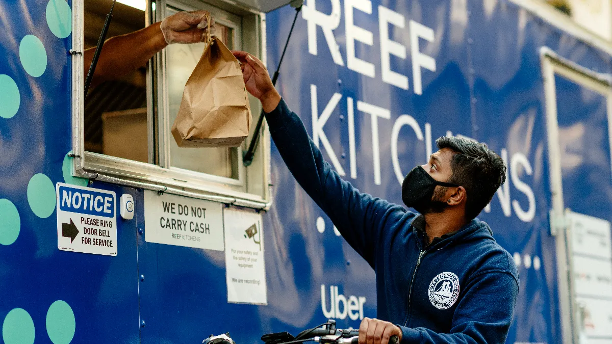 A man picks up an order from a Reef vessel. Photo by KATELYN PERRY