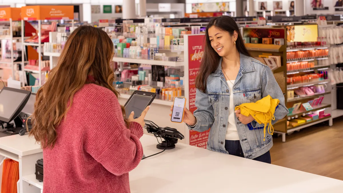 A customer using Happy Returns at an Ulta Beauty store