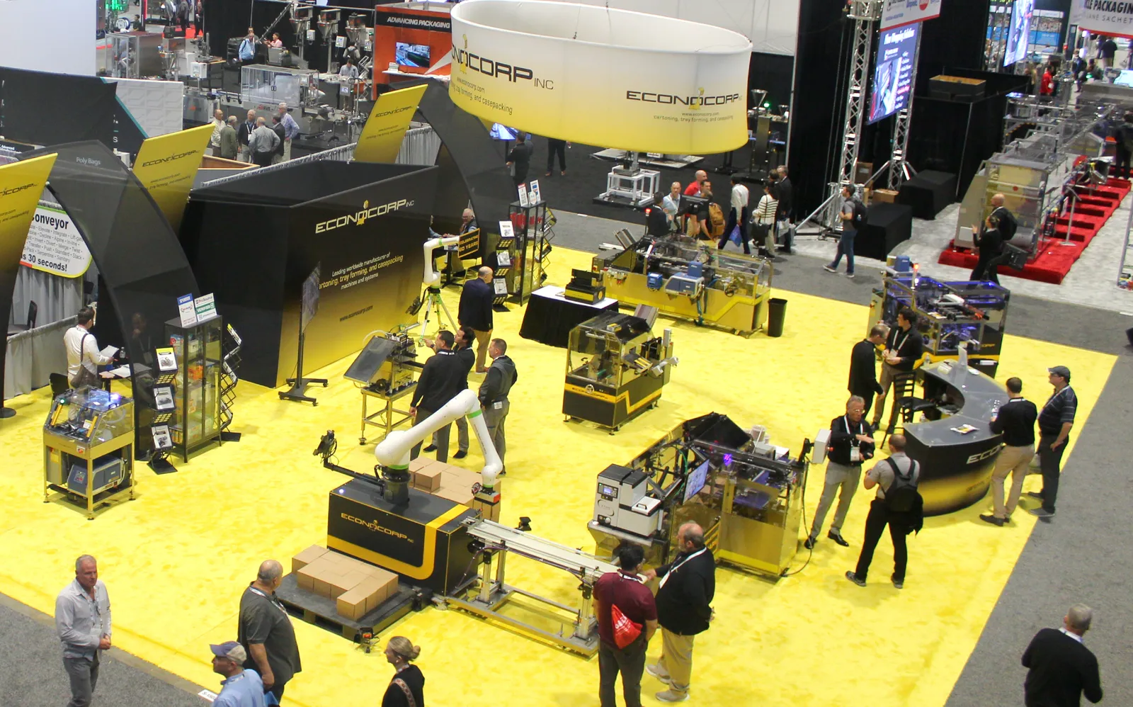 An aerial view of Econocorp and other exhibitioners set up in a large conference hall.