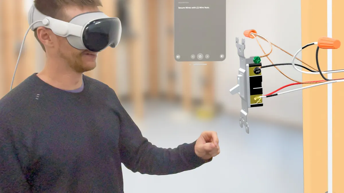Person wearing VR head gear while doing some sort of training standing up.