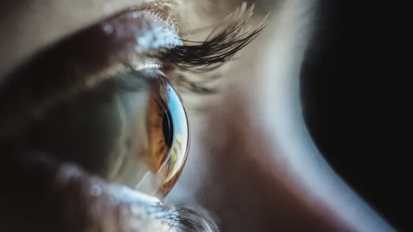 A close-up of a person's brown eye.