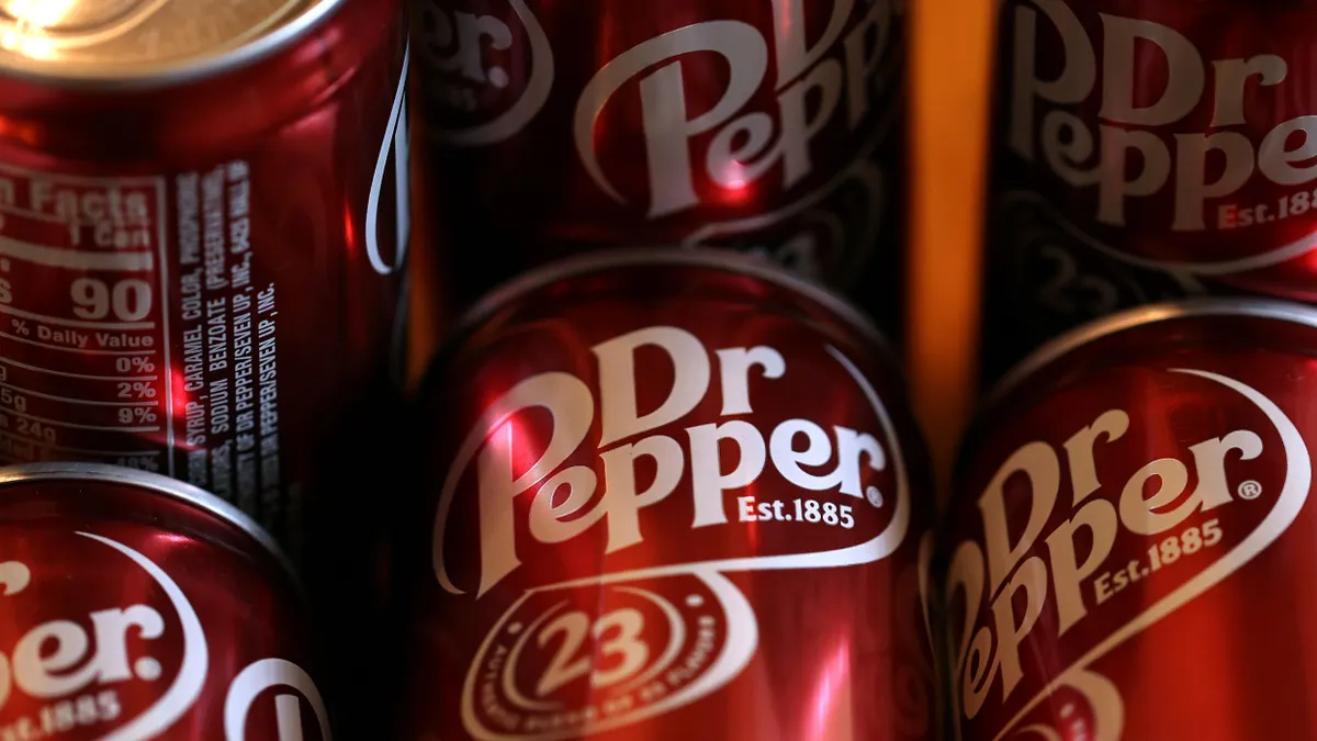 Cans of Dr Pepper on display.