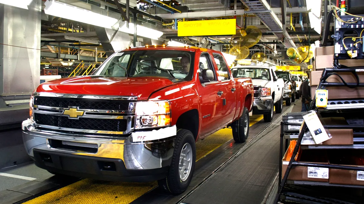 A Chevy pickup truck drives off the assembly line of the General Motors Flint Assembly Plant January 24, 2011 in Flint, Michigan.