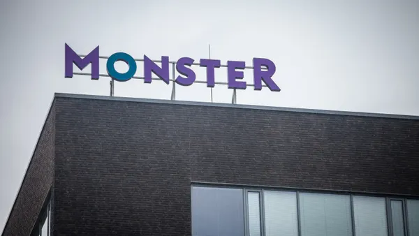 A sign of the logo of Bold Limited brand Monster.com in front an office in Brno, Czech Republic