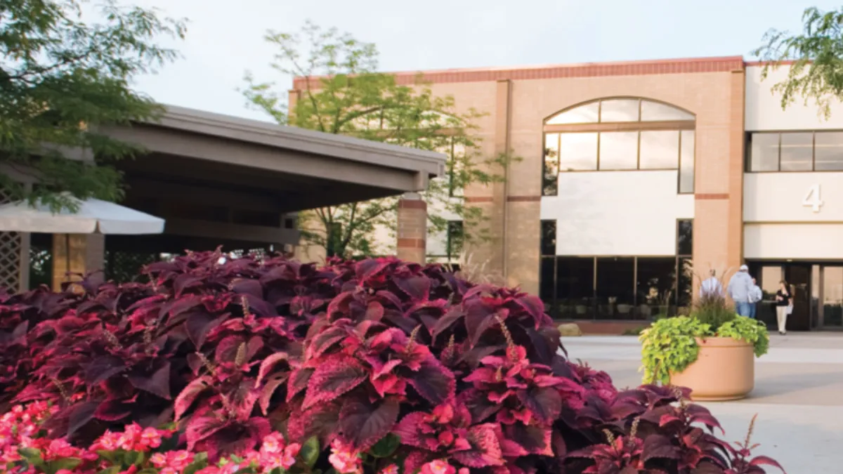 People enter and leave a building on the campus of Pittsburgh Technical College.