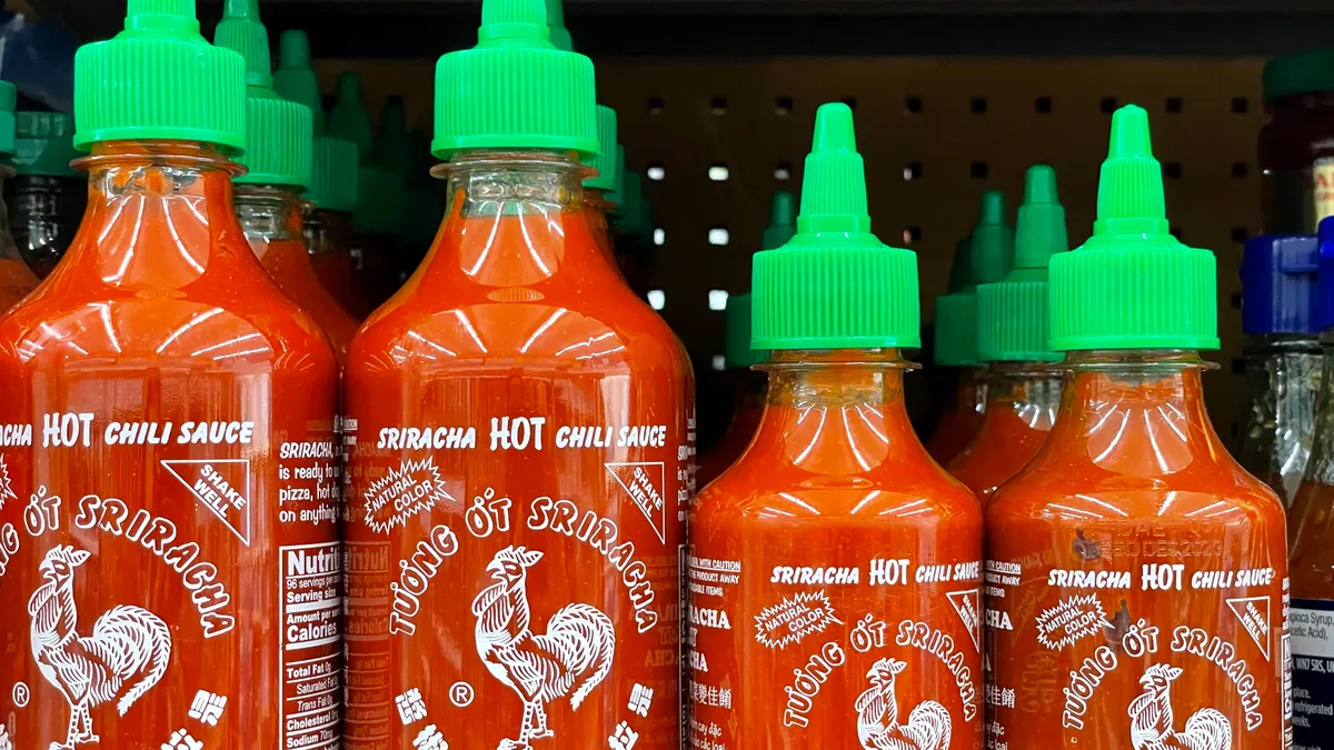 Huy Fong Food sriracha bottles on a shelf