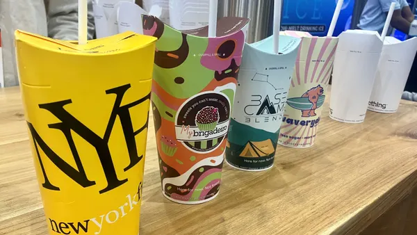 A row of colored sample products of Nothing cold cups