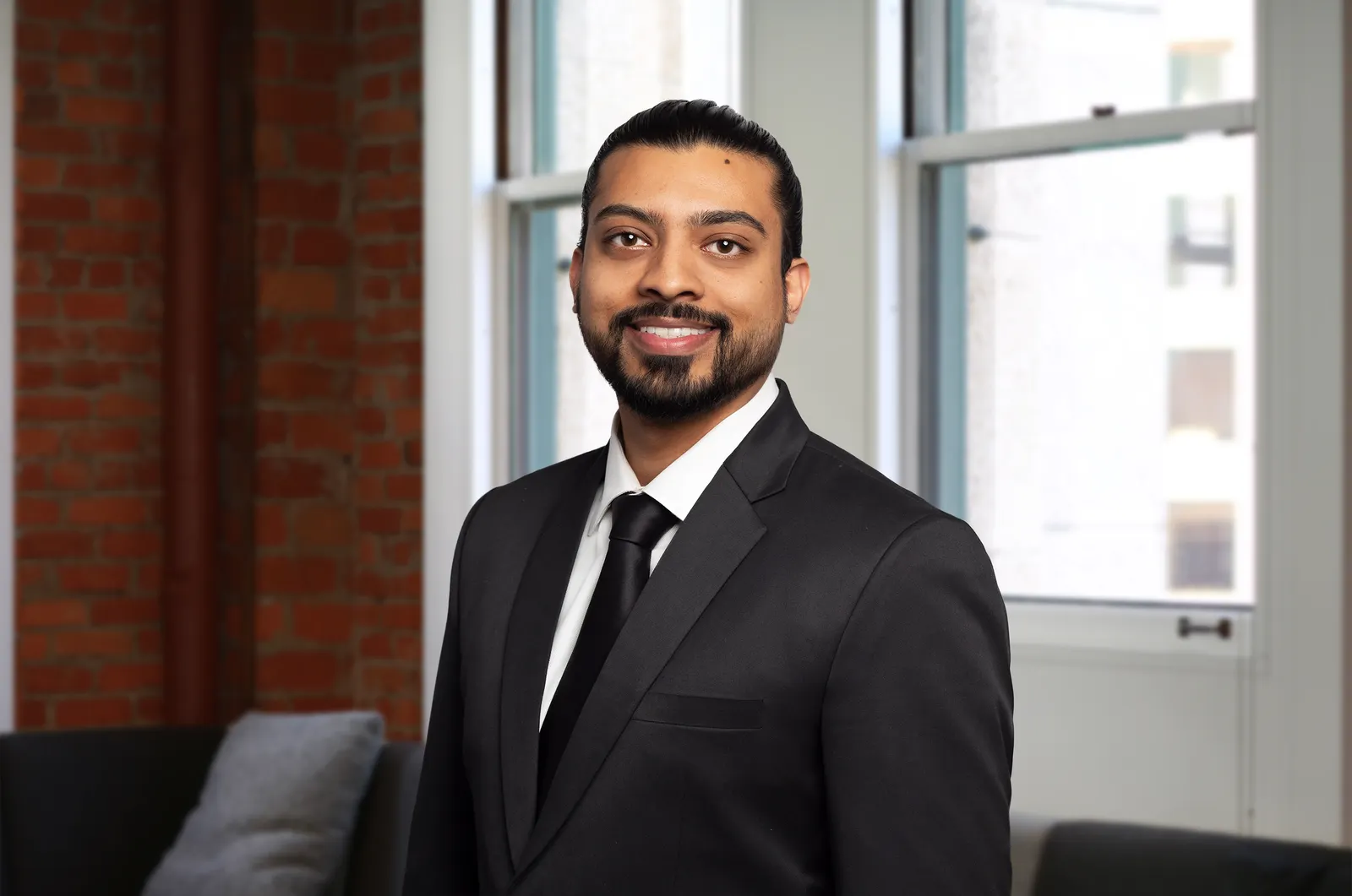 A headshot of Ryan Malhan.