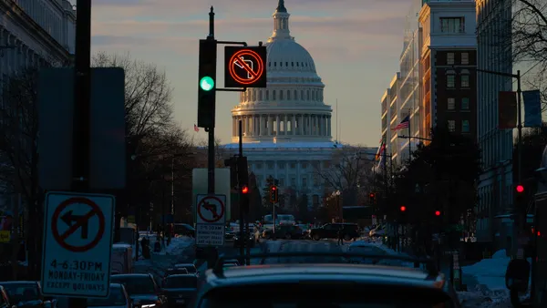 Morning traffic navigates snowy roads near the U.S. Capitol