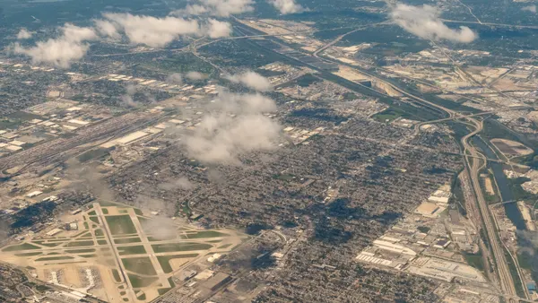 An aerial photo showing Chicago Midway International Airport and surrounding communities and highways.