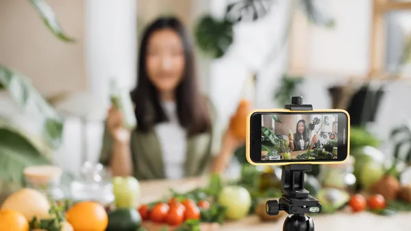 Person using phone creating video content for social media