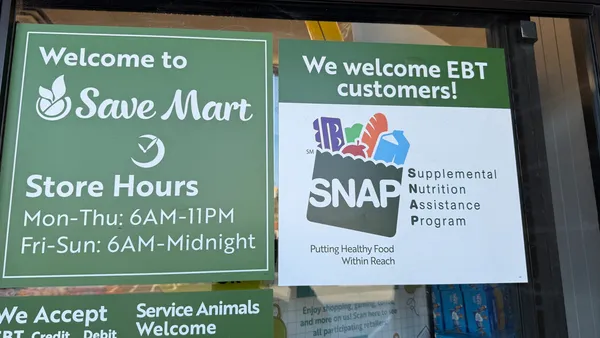 A sign about acceptance of SNAP EBT at a grocery store.