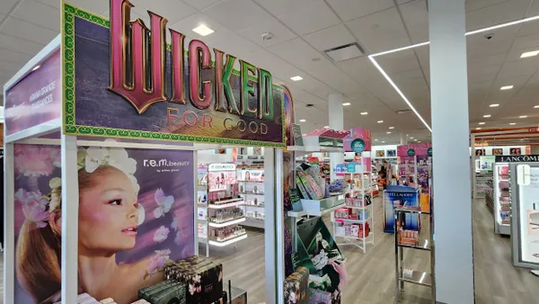 Cosmetics display of Wicked products, with shelves of other cosmetics in the background.