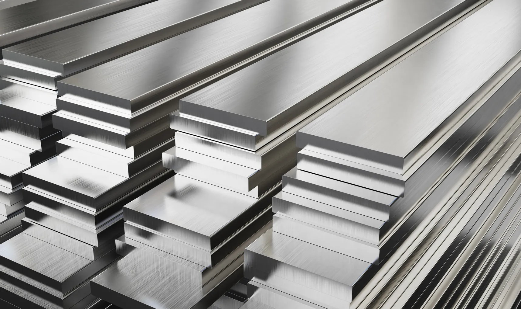 Stacks of shiny silver steel plates.