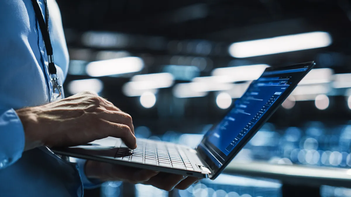 Programmer using digital laptop computer