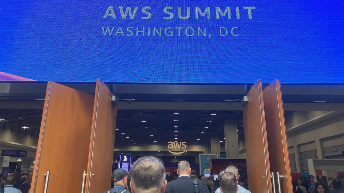 Attendees walk around the Walter E. Washington Convention Center in Washington, D.C during an AWS Summit on June 10, 2025.