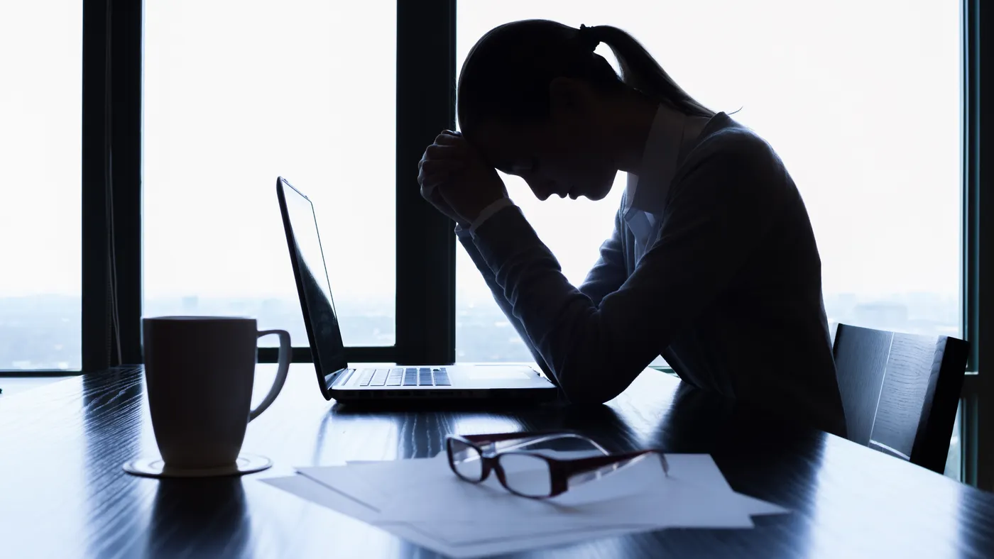 Stressed businesswoman at desk