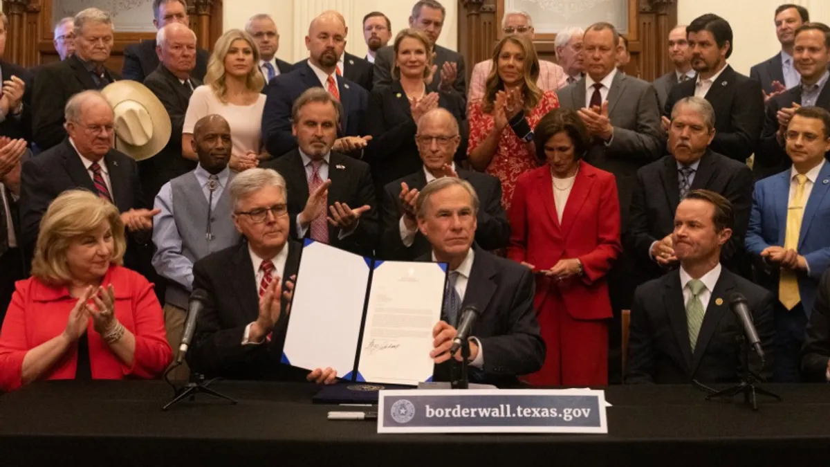 Texas Gov. Greg Abbott signs the border wall declaration for the state of Texas.