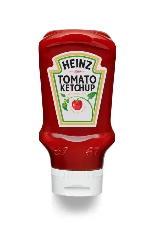 A squeezable bottle of Heinz ketchup.