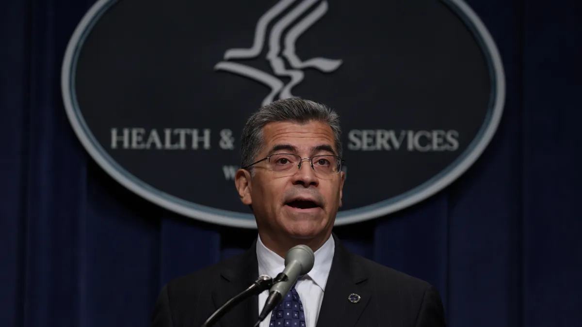 A picture of Xavier Becerra giving a speech at a podium