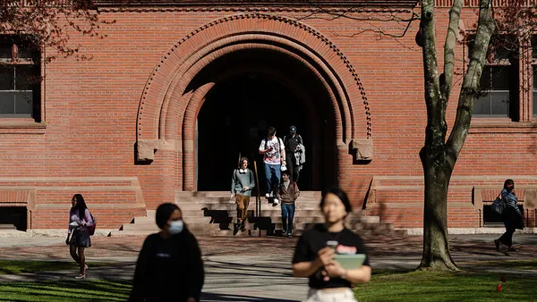Students walk through the campus of Harvard University.