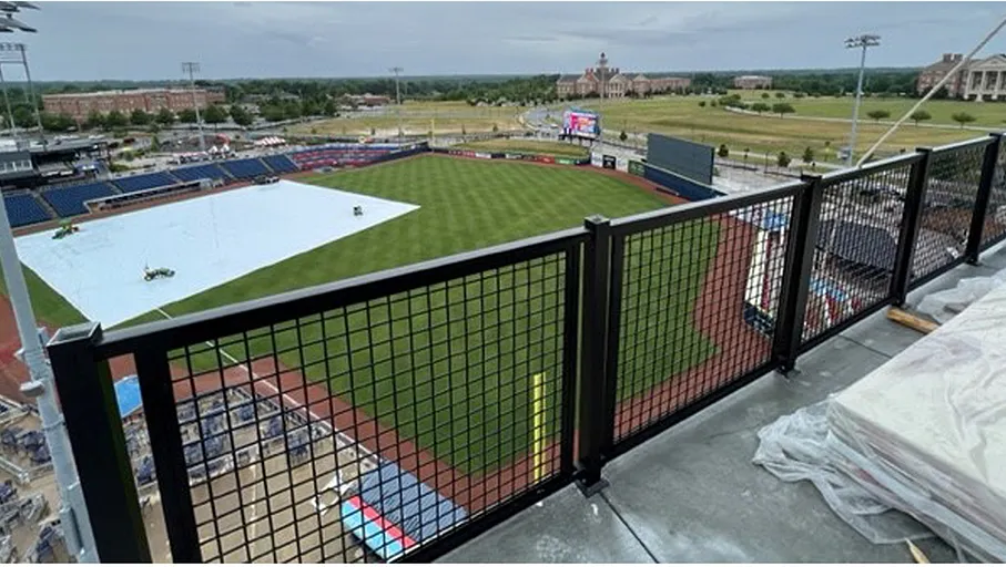 A deck rail with a grid pattern.