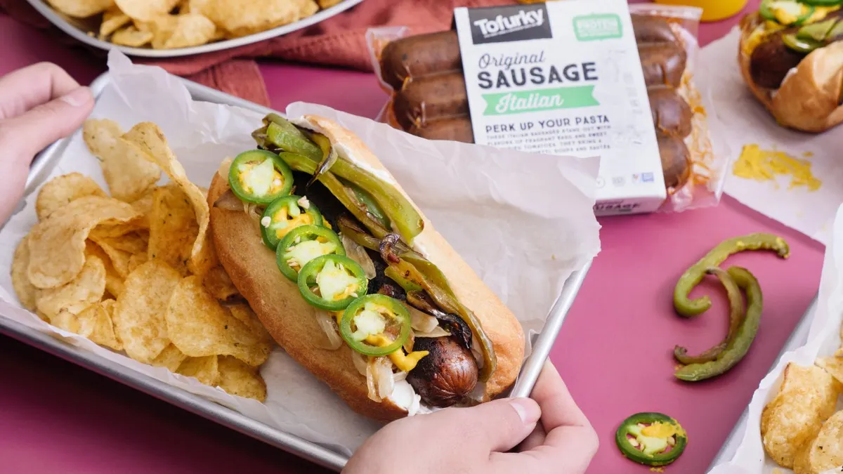 A Seattle-style dog made with Tofurky plant-based sausage
