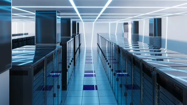 A large array of cloud storage servers are pictured in a modern data center.