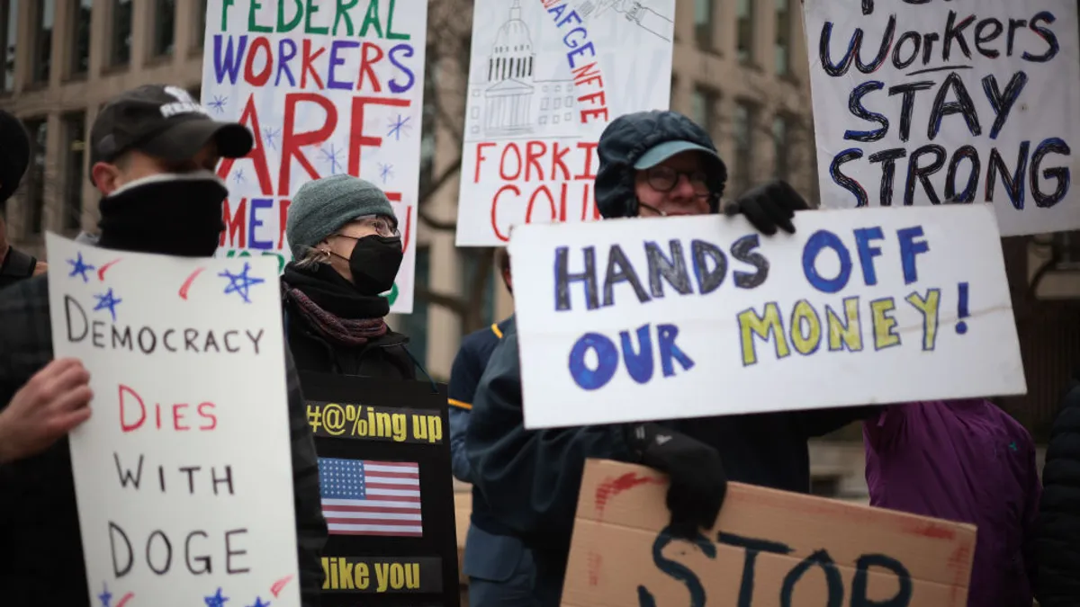 Protesters rally outside of the Theodore Roosevelt Federal Building.