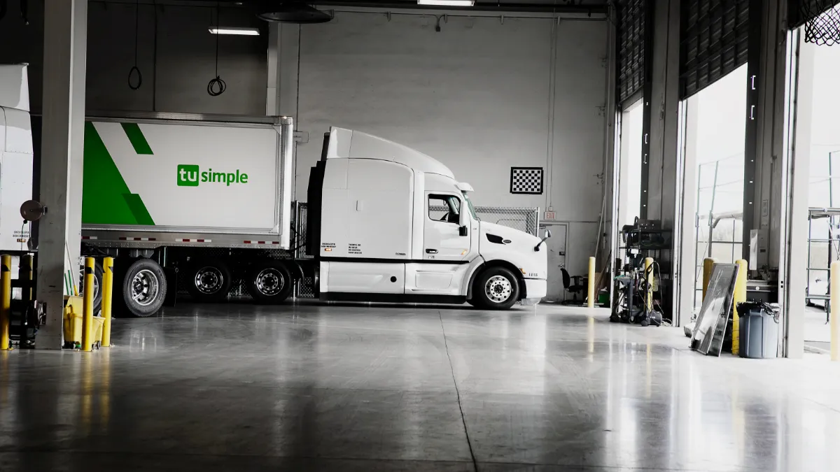 A TuSimple truck in a garage