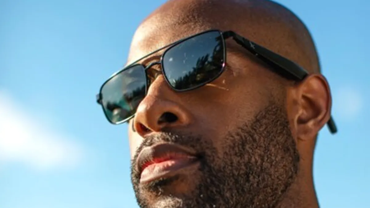 A person wears Eddie Bauer Navigator Smart Eyewear.