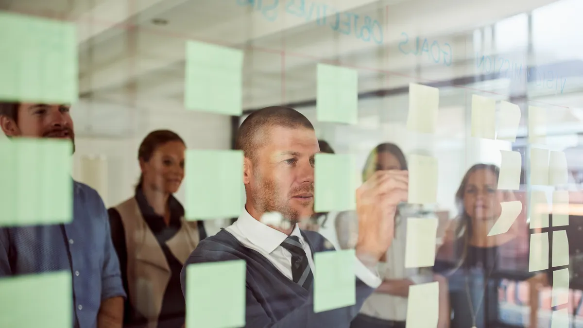 Shot of a businessman leading a brainstorming session with his colleagues in an office
