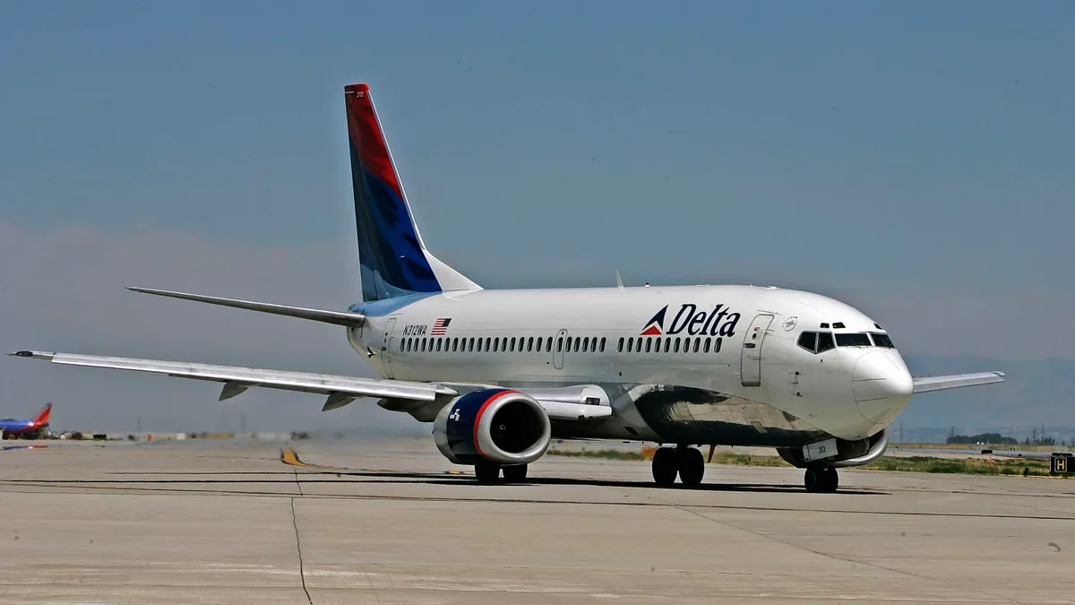 A Delta Airlines jet taxies for take-off at the Salt Lake International Airport August 12, 2005 in Salt Lake City, Utah.