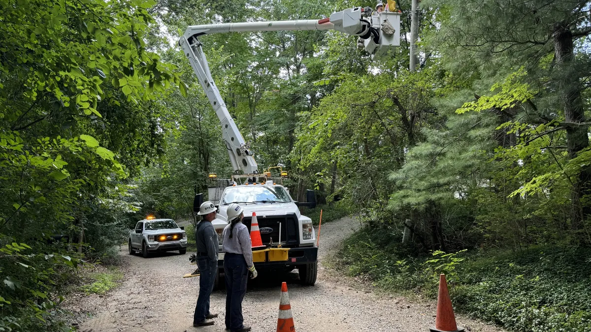 A DTE Energy crew performs reliability work using a bucket truck.