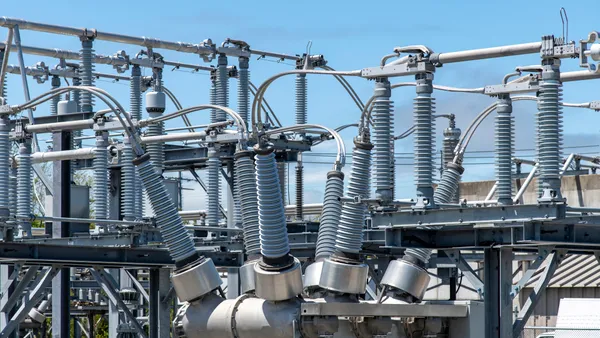 A high-voltage electric transformer at a utility substation.