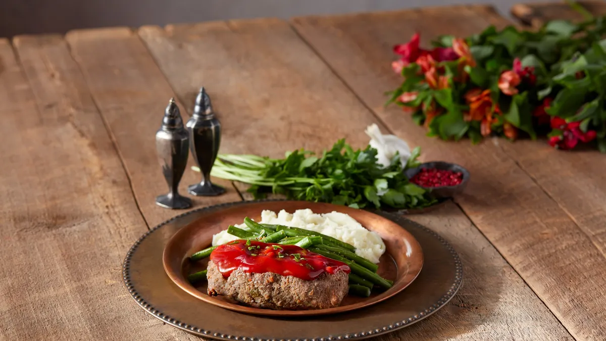 A photo of meatloaf from Travel Center's of America's dinner menu.