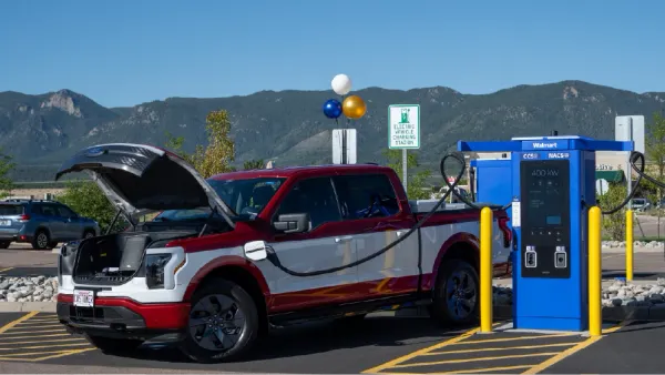 A Ford F-150 Lightning charging at a Walmart Supercenter