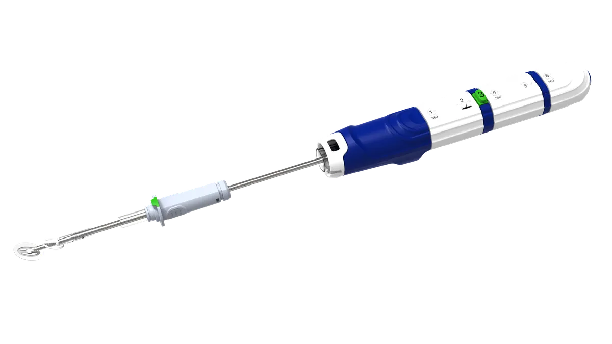 An image of a medical device with a white and blue handle, a metal rod and a circular tip.