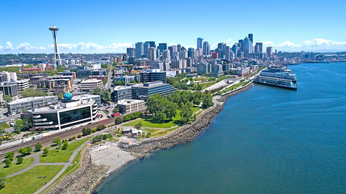 Aerial shot of waterfront parks and city skyline