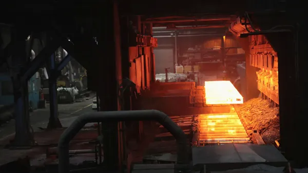 a hot slab of steel glows orange