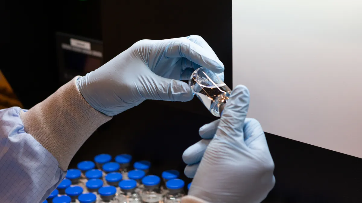 Visual inspection of investigational remdesivir, photo by Gilead Sciences