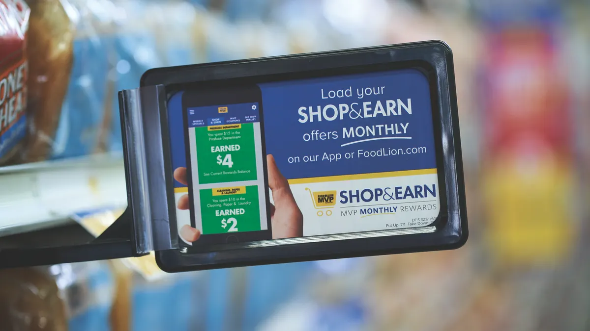 An in-store sign for a grocer's loyalty program.