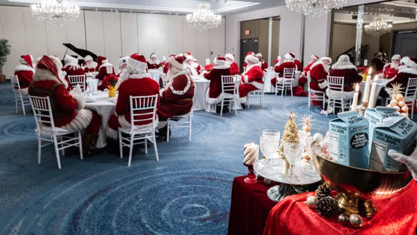 A group of Santas taste test oatmilk and croquembouche