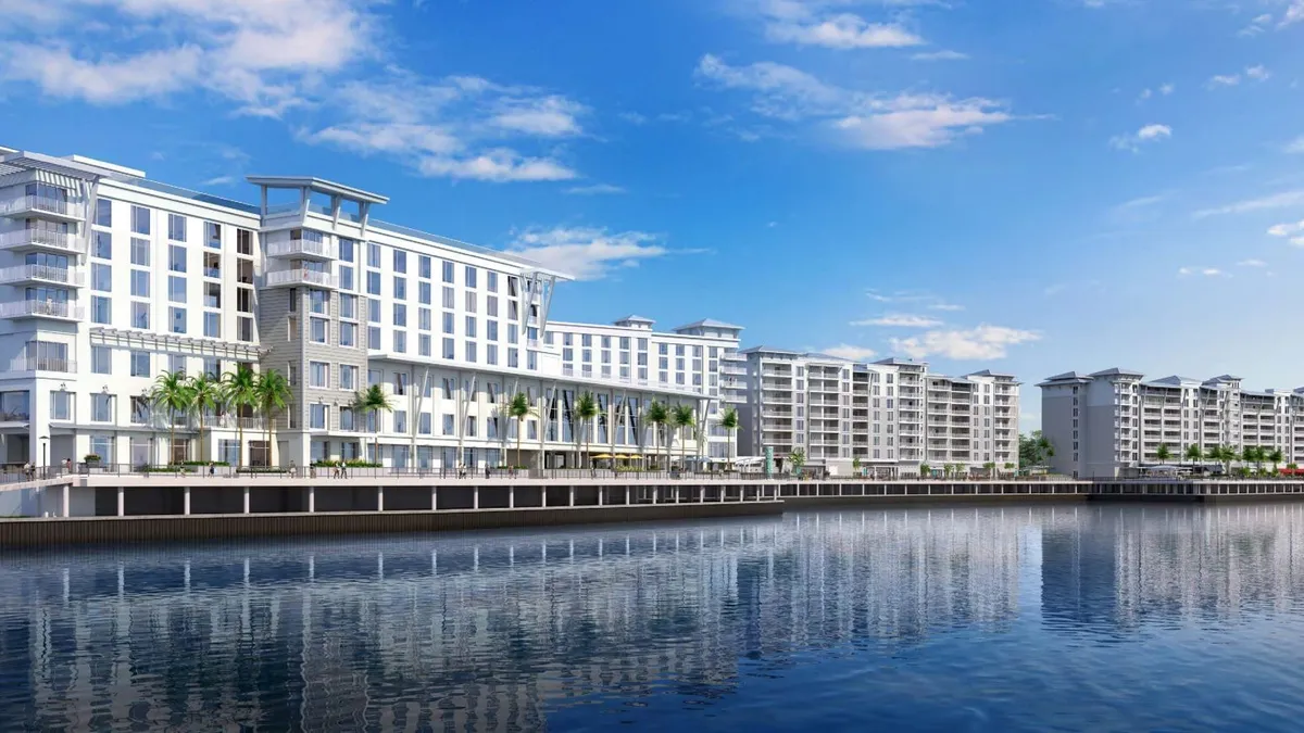 A rendering of the Sunseeker Resort features a white facade along the waterfront.