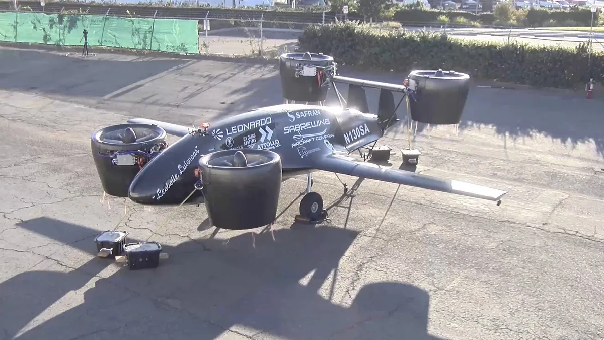 Sabrewing's "Alpha" cargo drone aircraft sits on a platform.