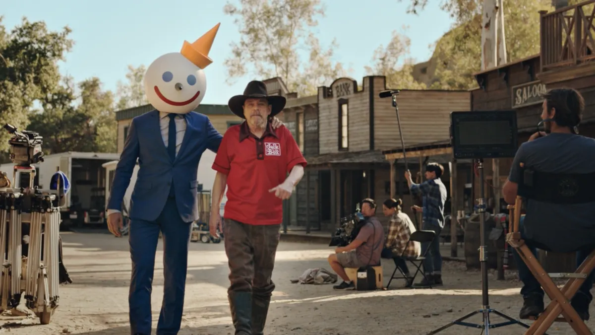 Jack in the Box mascot Jack Box is accompanied by actor Mark Hamill on the set of a commercial