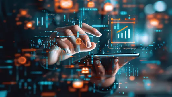 A hand pointing towards a digital board