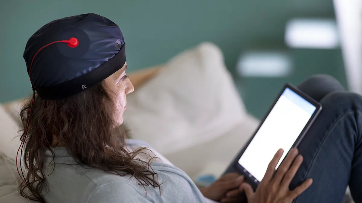 A patient using Sooma's Transcranial Direct Current Stimulation (tDCS), a non-invasive brain stimulation treatment that modules neuronal activity.