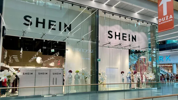 A Shein storefront in a mall. The windows read Shein and there are mannequins.