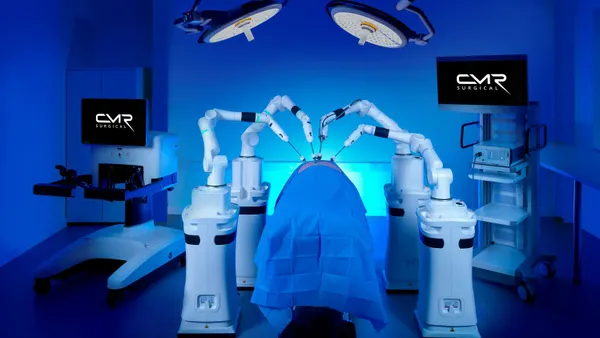 CMR Surgical's Versius Plus robotic system is shown in blue lighting.